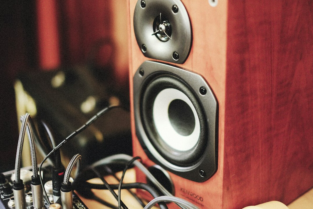 Home recording studio with mixing console and speakers