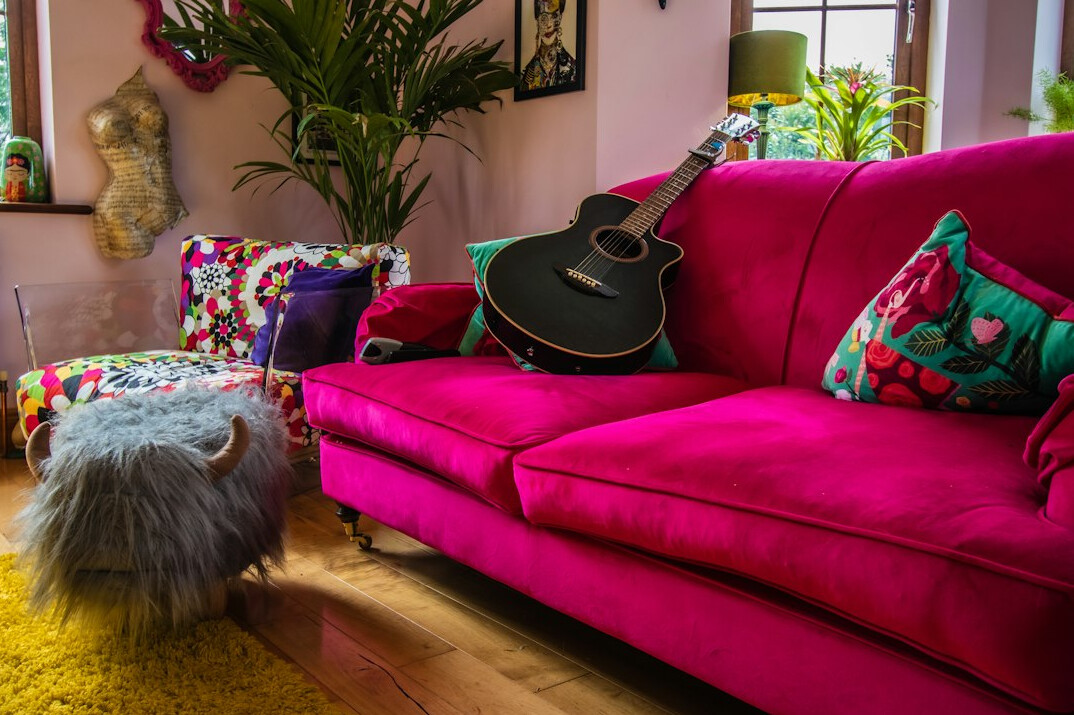 Deep retro sofa in a lounge with bold accent colours